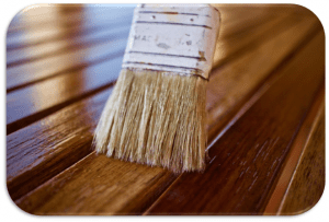 Brush smoothing varnish on wood